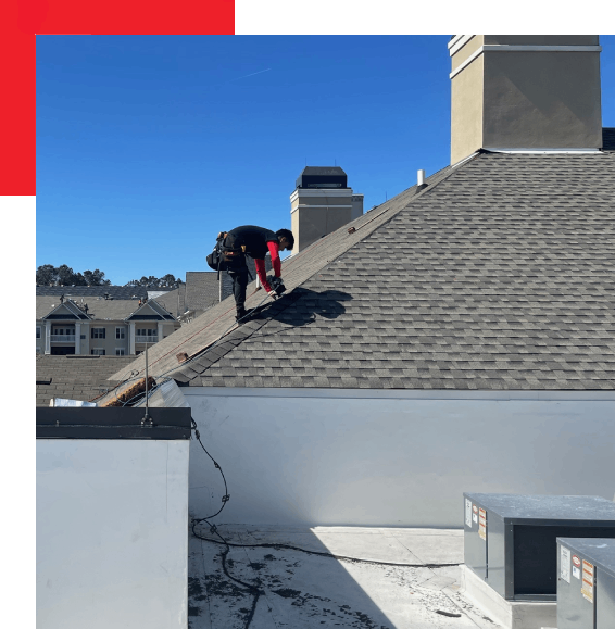 A person climbing a roof to work on it