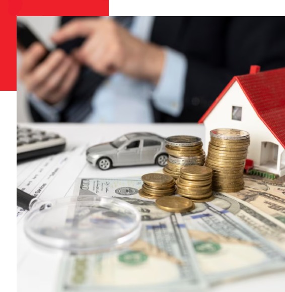 a model house with coins and dollars placed in front of it