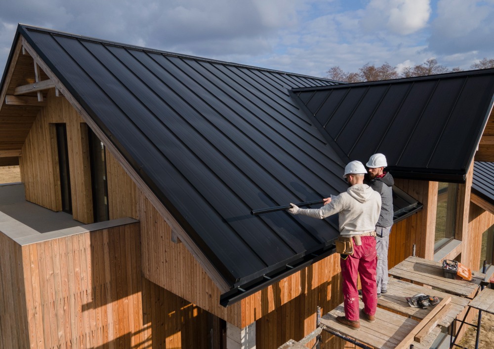 two workers working on a roof