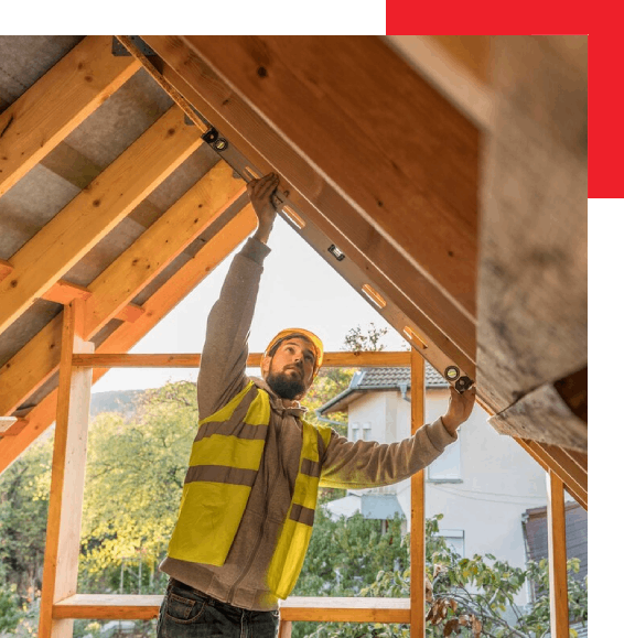 a worker measuring the roof