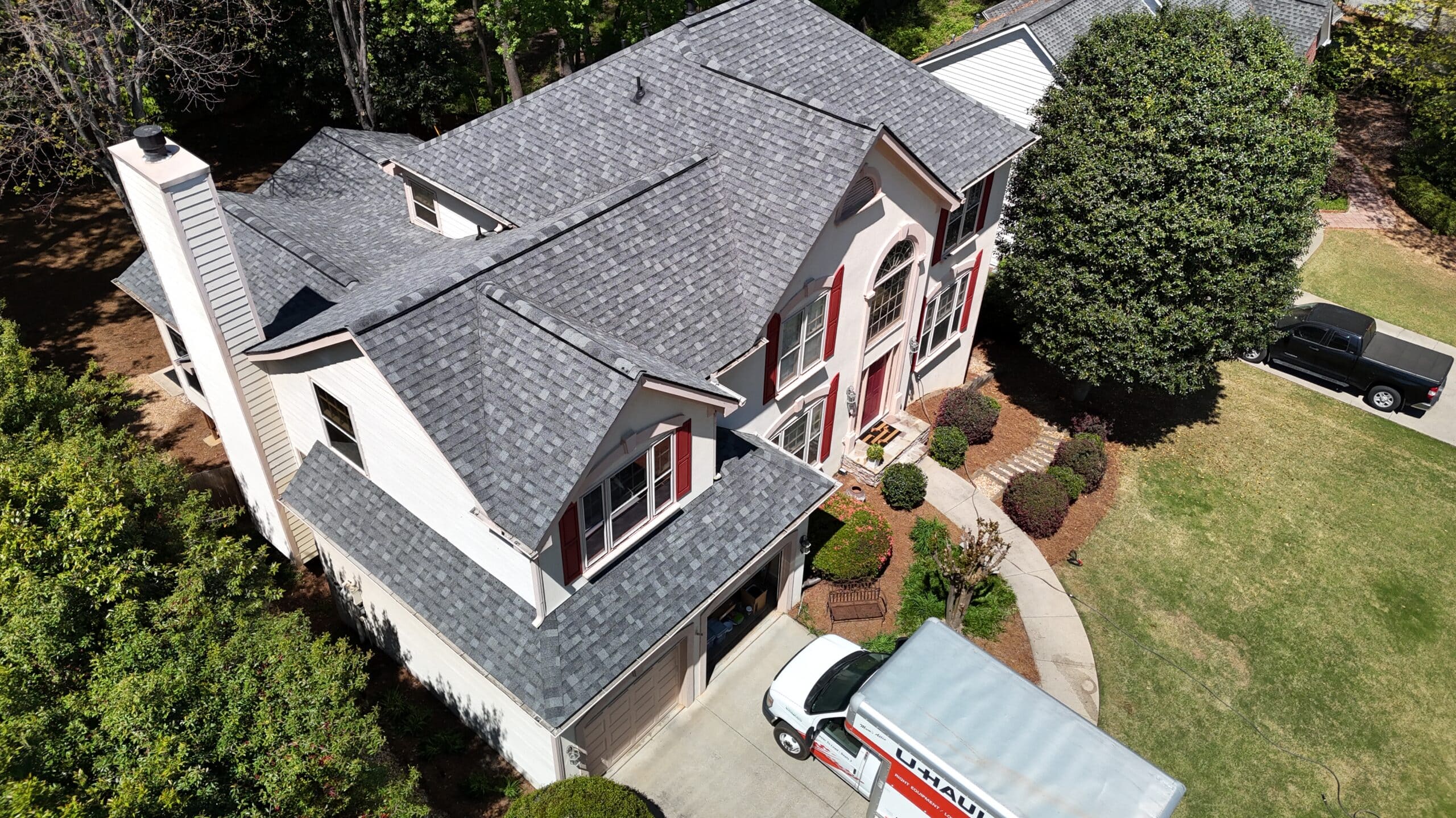Completed architectural shingle roof by Red Roofing and Gutters