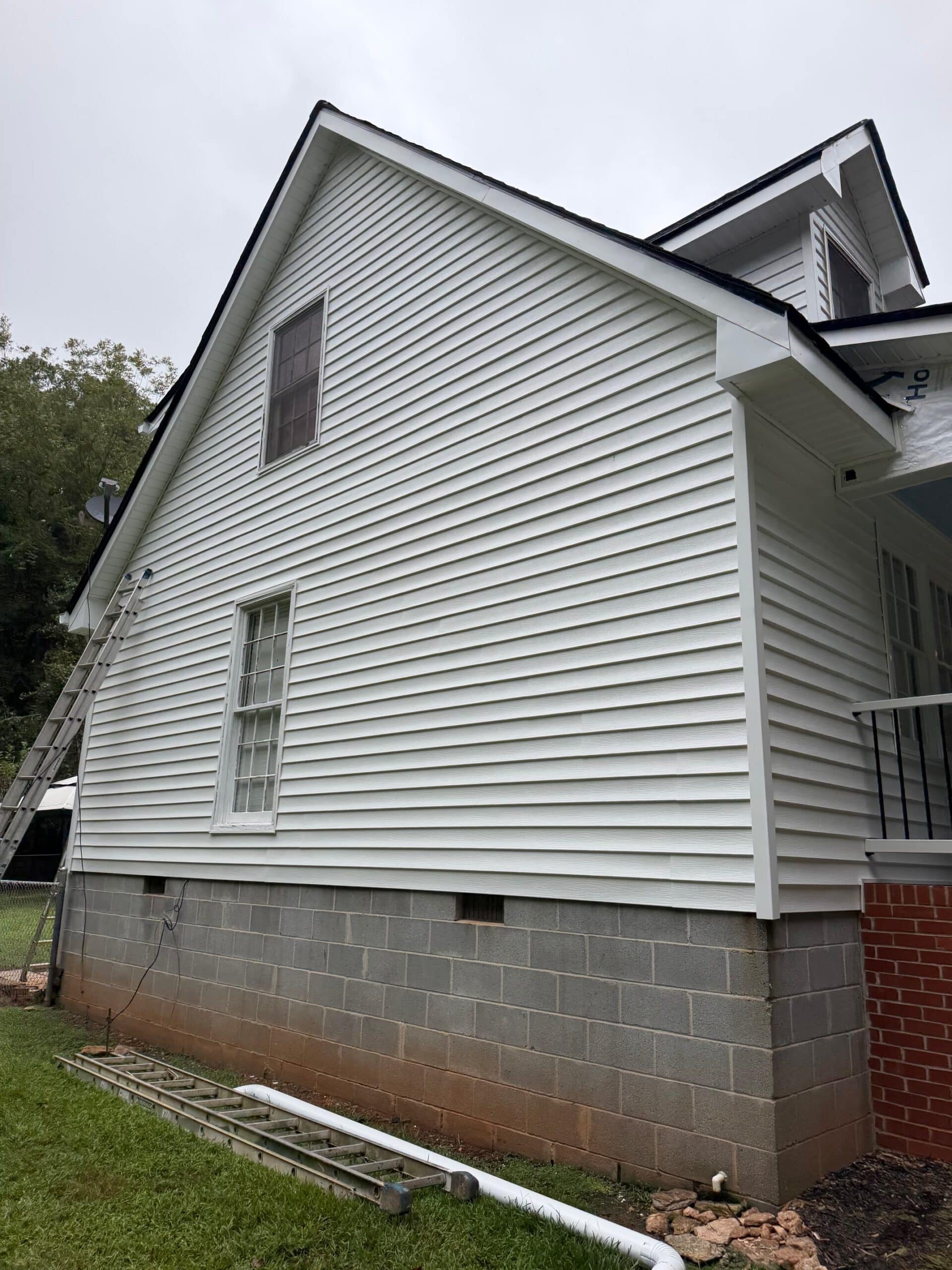 Vinyl Siding Greensboro Ga 2 Vinyl siding Greensboro GA project: new white siding on a gable end with a crawlspace foundation